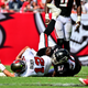 Tom Brady gets sacked in a game against the Falcons